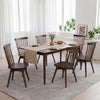 Mid-century rubber wood dining chairs with swivel seats, featuring a comfortable spindle back, ideal for kitchen use.