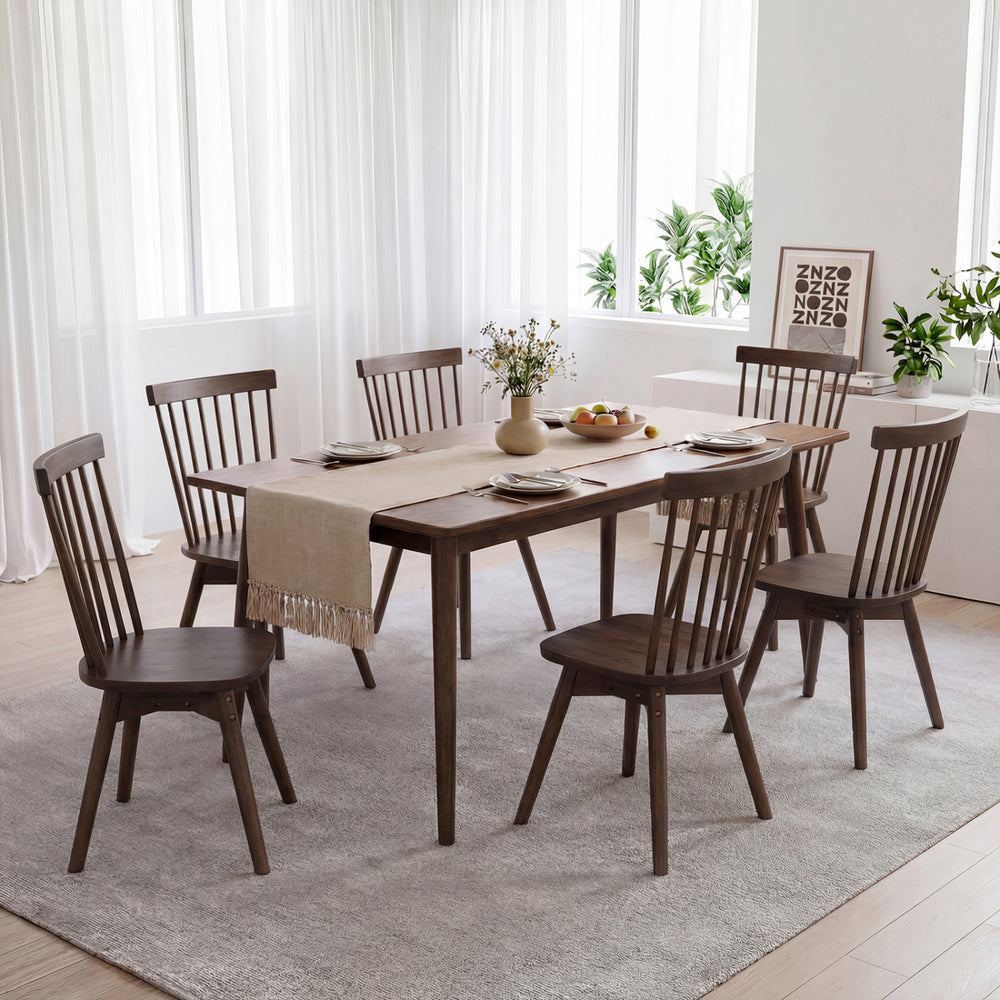 Mid-century rubber wood dining chairs with swivel seats, featuring a comfortable spindle back, ideal for kitchen use.