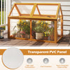 Wood cold frame greenhouse with transparent PVC panels and adjustable roof for plant protection and ventilation.