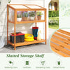Wood cold frame greenhouse with openable roof and slatted storage shelf for organizing gardening tools and supplies.