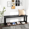 Black wood dining bench with metal frame, showcasing a cozy interior setup and ample shoe storage space.