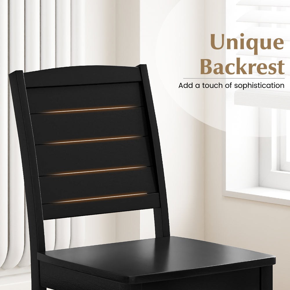 Black wood dining chair featuring a unique backrest design, sturdy rubber wood legs, perfect for kitchen or dining use.