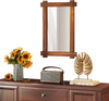 Wood framed mirror with acacia wood and vintage rivet design, enhancing rustic appeal in a living room setting.