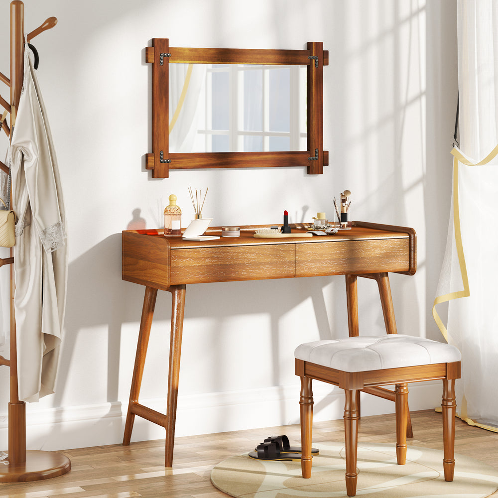 Wood framed mirror with acacia wood and vintage rivet design, enhancing rustic appeal in a stylish living space.
