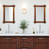 Wood framed mirror with acacia wood and vintage rivet design, enhancing rustic farmhouse appeal in a bathroom setting.
