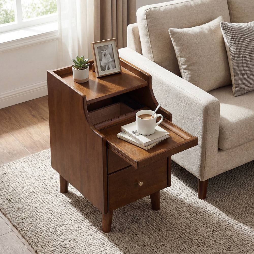 Brown wood nightstand with a drawer and solid wood legs, styled beside a sofa, perfect for bedroom storage.