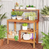 Wooden outdoor garden potting workstation with open shelves, featuring solid wood construction and ergonomic design for.