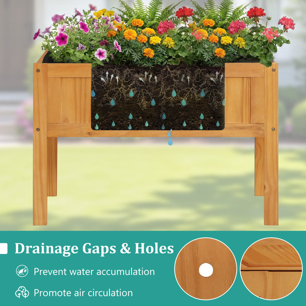 Wood raised garden bed with drainage holes, featuring vibrant flowers, ideal for growing vegetables and herbs.
