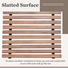 Widened slatted seat detail of outdoor acacia wood rocking chair, promoting ventilation for comfortable relaxation.