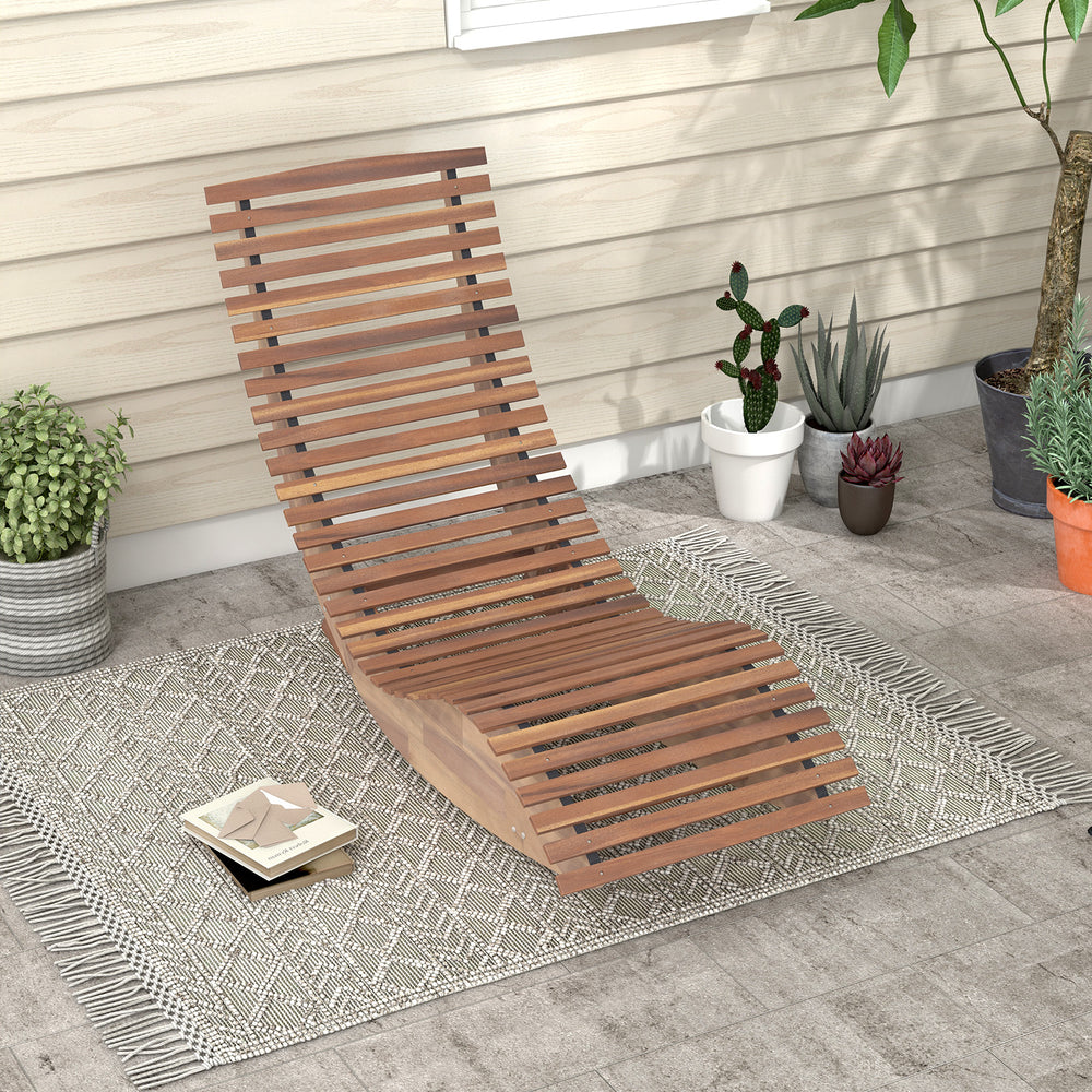 Outdoor acacia wood rocking chair with slatted seat and high back, perfect for backyard relaxation and comfort.