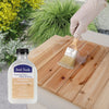 Applying Just Teak Premium Wood Wax Oil on a wooden surface for outdoor and indoor furniture restoration and protection.