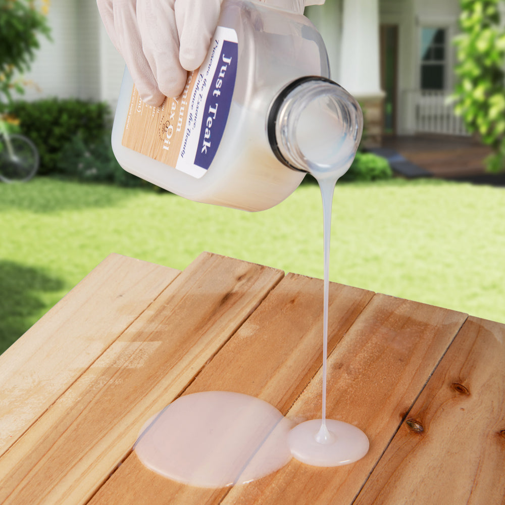 Clear wood oil cleaner being poured onto a wooden surface, ideal for restoring outdoor and indoor furniture.