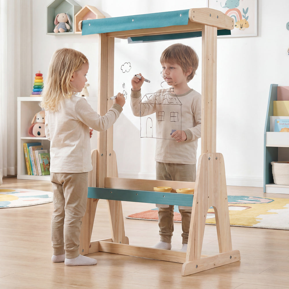 Children using a wooden art easel with a transparent board and paper roll, featuring a fir wood frame for stability.
