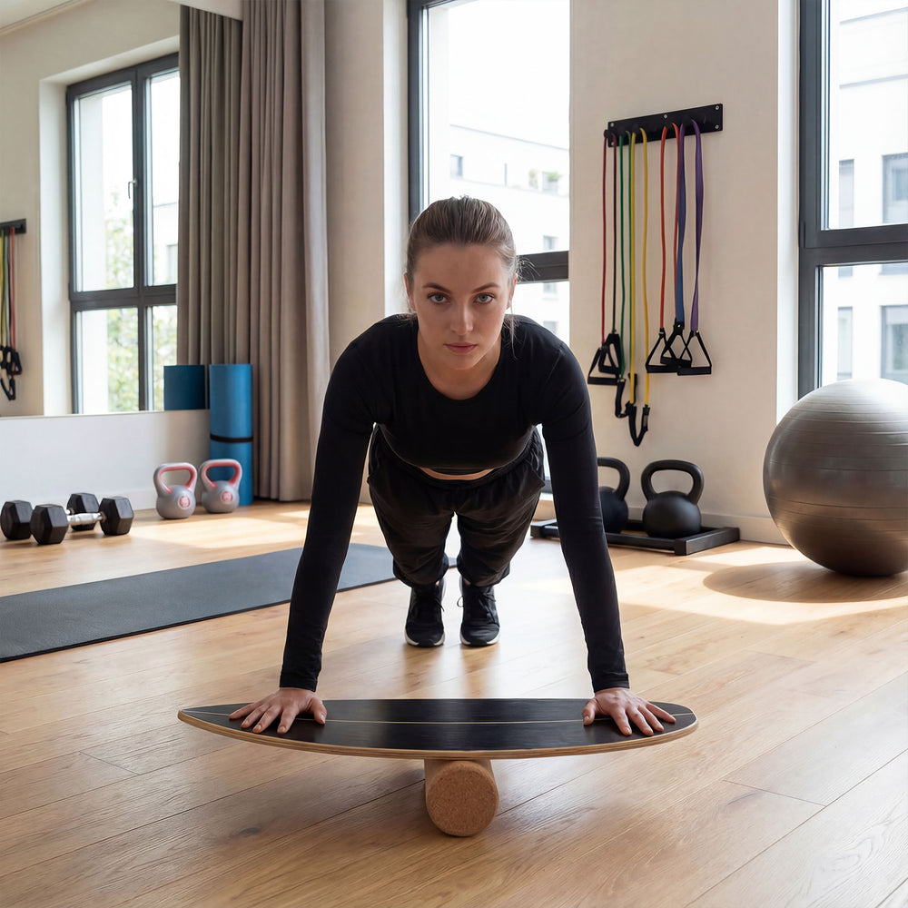 Wooden balancing board with cork roller, designed for enhancing balance and core strength, ideal for various sports.