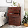 Wooden chest of drawers with seven spacious drawers, metal handles, and a charming wood grain finish for bedroom.