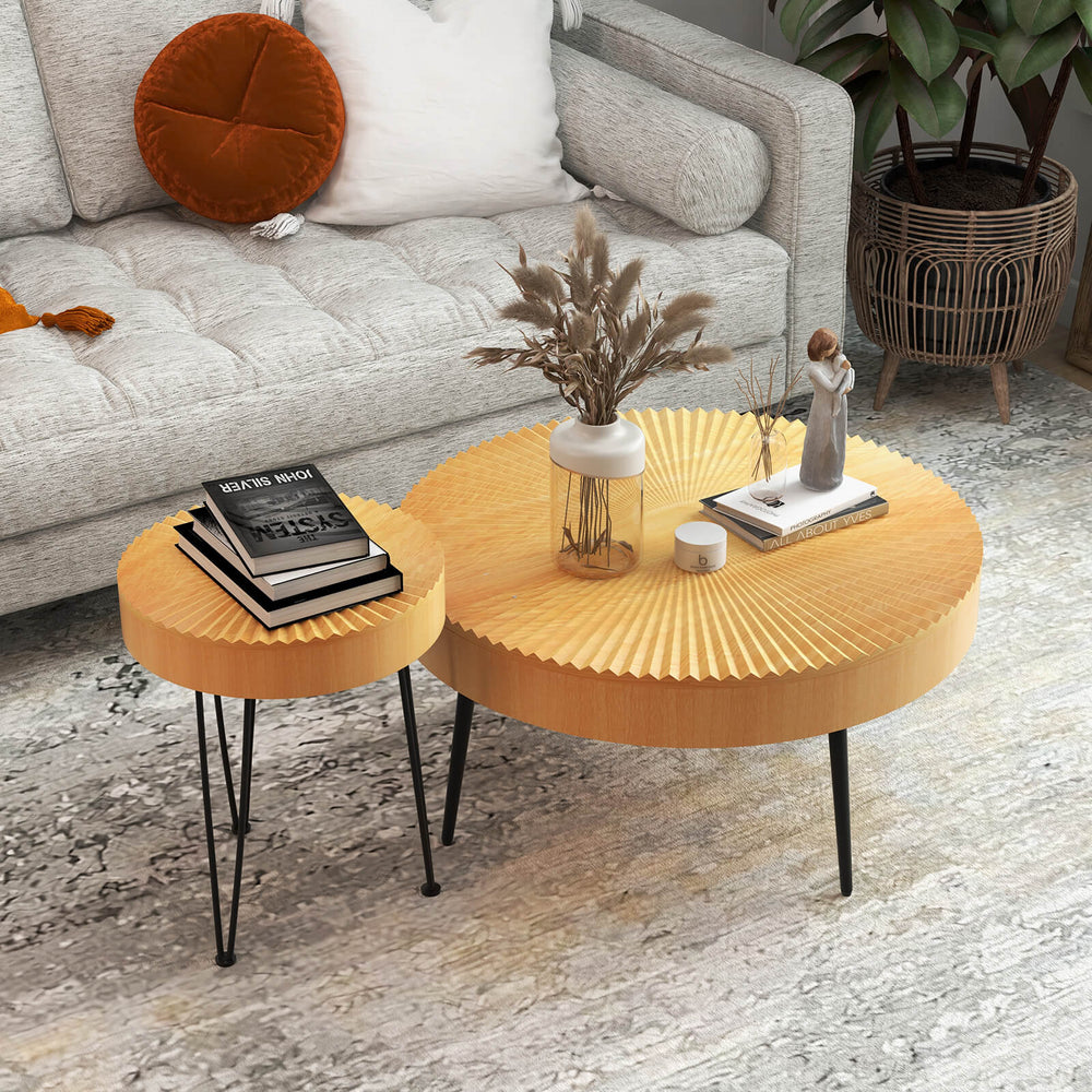 Two wooden coffee tables with radial pattern and metal legs, perfect for cups and magazines in any living space.
