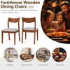 Set of 2 wooden dining chairs with walnut finish, padded seats, and curved backrests for comfortable dining experiences.