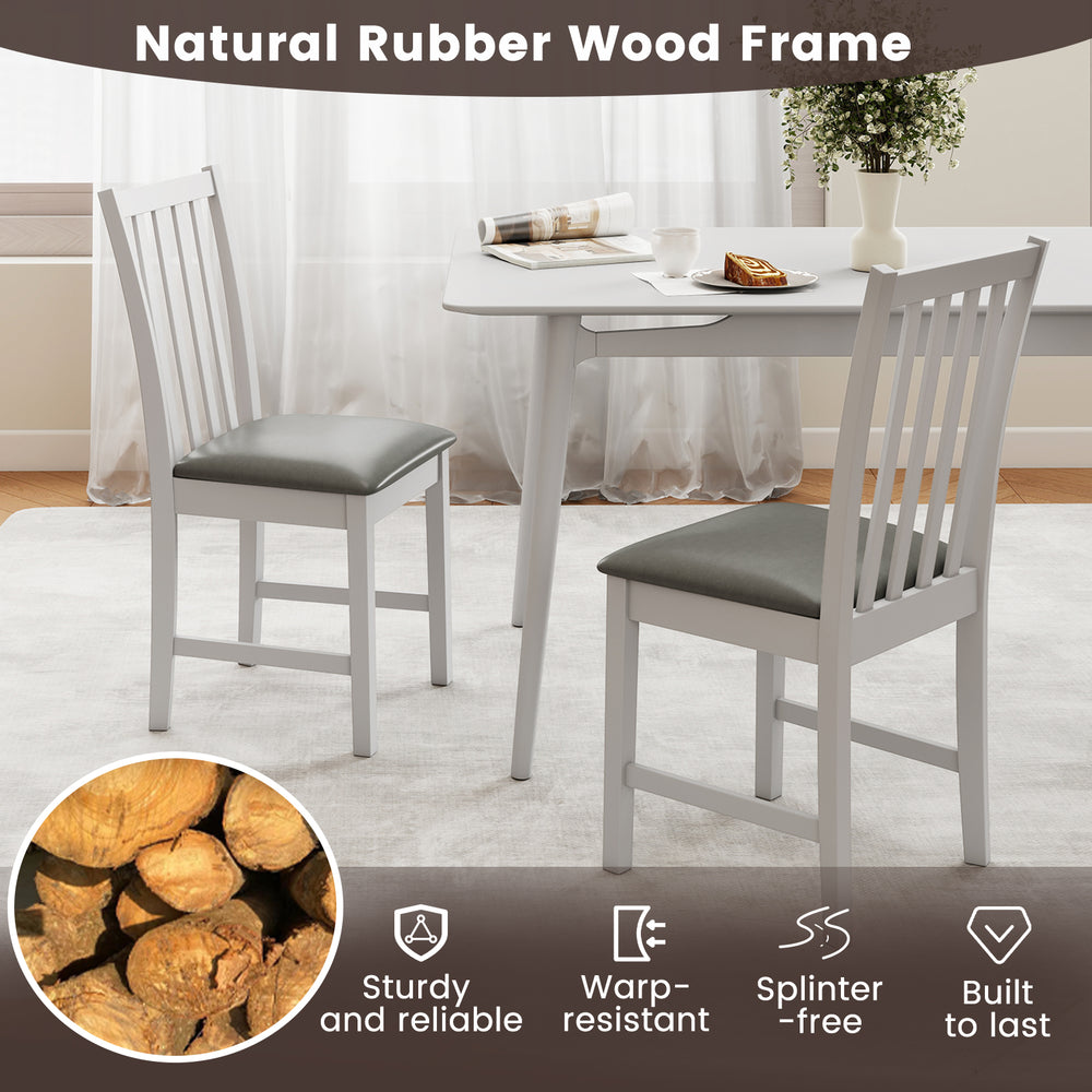 White wooden dining chair set of 2 with padded seats, crafted from durable rubber wood for dining rooms and cafes.