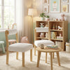 Two wooden dining chairs with rubber wood frames and white faux sherpa upholstery, perfect for stylish dining areas.