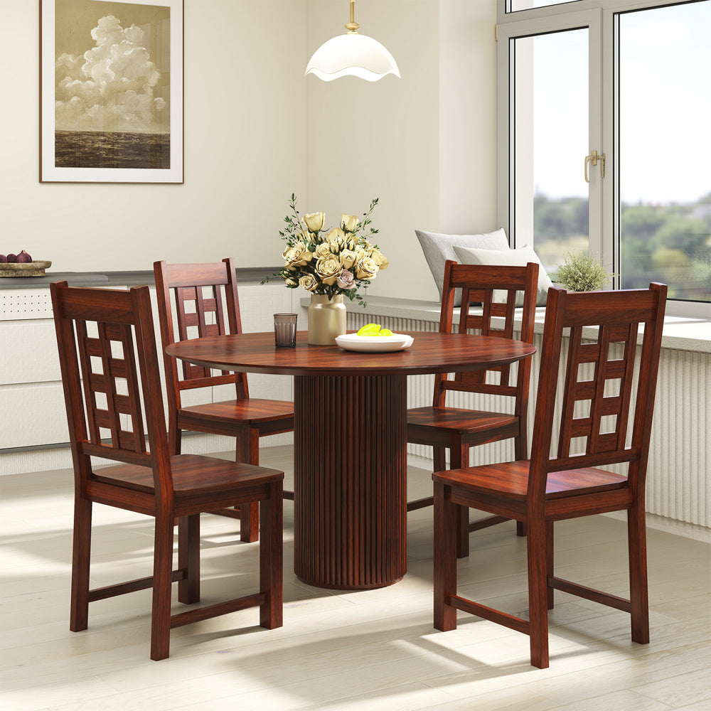 Round dining table set with four walnut wooden chairs, showcasing a solid rubber wood frame and elegant design for.