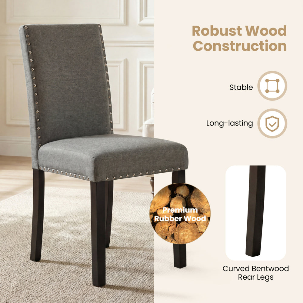 Wooden dining chair with curved back, rubber wood legs, and nailhead trim, perfect for home or cafe settings.