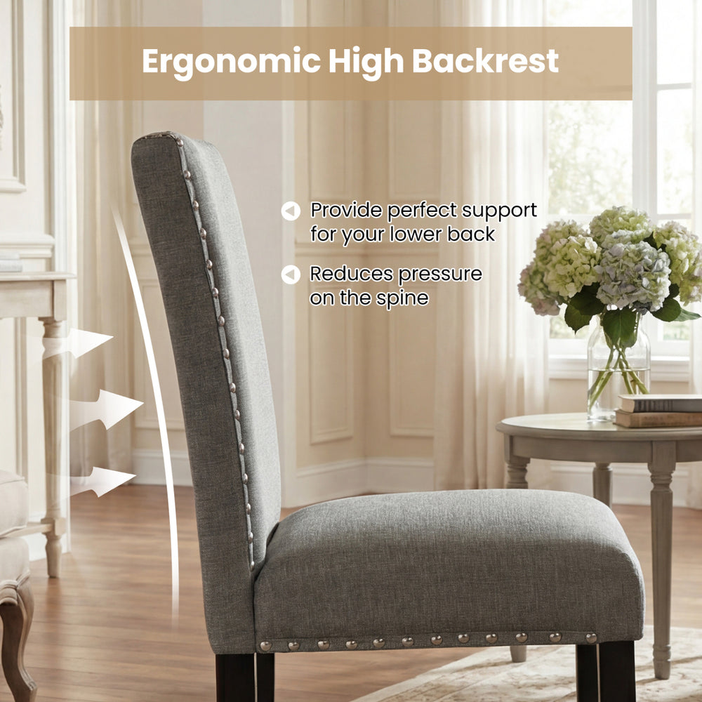 Side view of a wooden dining chair with ergonomic high backrest, soft cushions, and stylish nailhead trims for comfort.