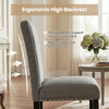 Side view of a wooden dining chair with ergonomic high backrest, soft cushions, and stylish nailhead trims for comfort.