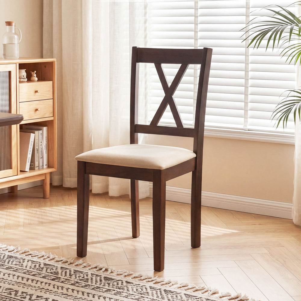 Single armless chair with padded seat and curved backrest, featuring rubber wood legs for a space-saving dining set.
