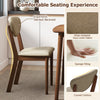 Wooden dining chair with ergonomic slanted backrest and padded seat, featuring skin-friendly fabric for comfort.