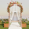 Wooden garden arbor with floral arch, featuring planter boxes and trellis for climbing plants, perfect for outdoor.