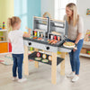 Wooden kids barbecue grill playset with grilling tools, storage shelves, and two compartments for imaginative play.
