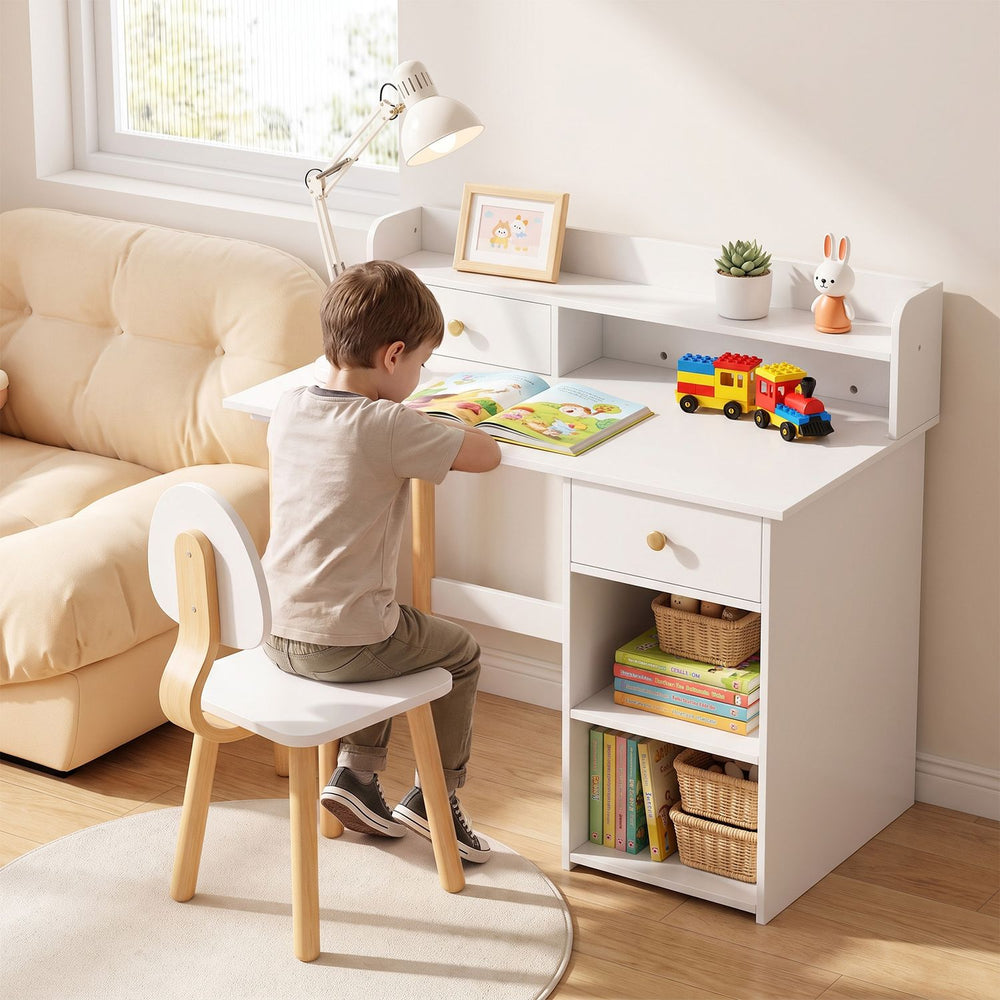 White wooden kids desk and chair set with hutch, drawer, and open shelves shown in a bedroom study nook.