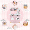 Wooden kids kitchen playset in pink featuring a coffee maker, oven, and rotating knobs for realistic play.