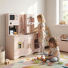 Wooden pink kids' pretend play kitchen with microwave, coffee maker, and accessories for imaginative cooking fun.