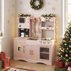 Wooden kids pretend play kitchen in pink showcases a sink with a 360° rotating faucet and cute retro curtains for fun.