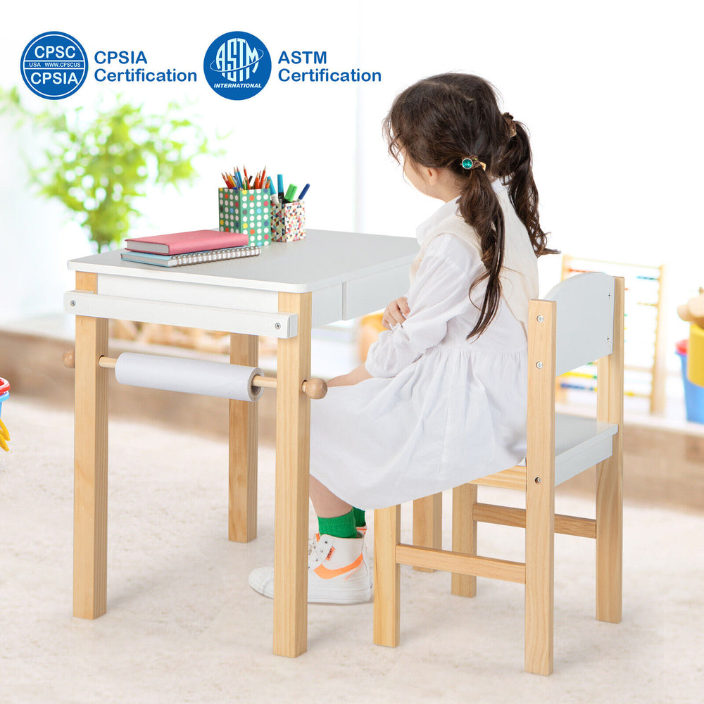 Kids art table and chair set in white with natural wood legs, featuring a paper roll and drawer for creative activities.