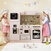 Wooden kids kitchen playset in pink with lighted microwave, sink, and accessories for imaginative play and skill.