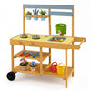 Wooden outdoor mud kitchen for kids in yellow with 2 stoves, sink, flowerpots, and wheels for mobile play.