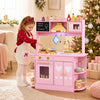 Wooden play kitchen for kids in pink with glowing stoves, realistic sounds, and ample storage for imaginative cooking fun.