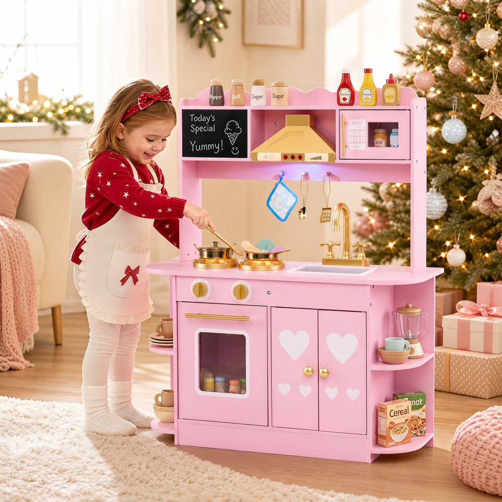 Wooden play kitchen for kids in pink with glowing stoves, realistic sounds, and ample storage for imaginative cooking fun.