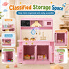 Wooden play kitchen for kids in pink with real lights and sounds, featuring multiple storage compartments for organized play.