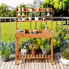 Wooden potting bench table with 3-tier open shelf, ideal for gardening tasks on patios or in gardens.