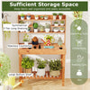 Wooden potting bench with 3-tier open shelf, spacious countertop, and large bottom shelf for gardening tools and plants.
