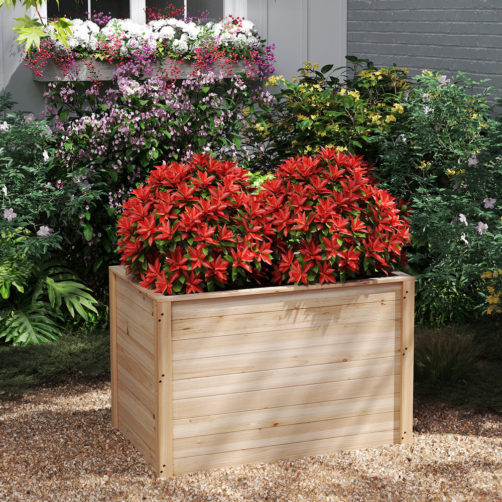 Wooden raised garden bed planter box made of fir wood, featuring vibrant flowers, ideal for nurturing deep-root plants.