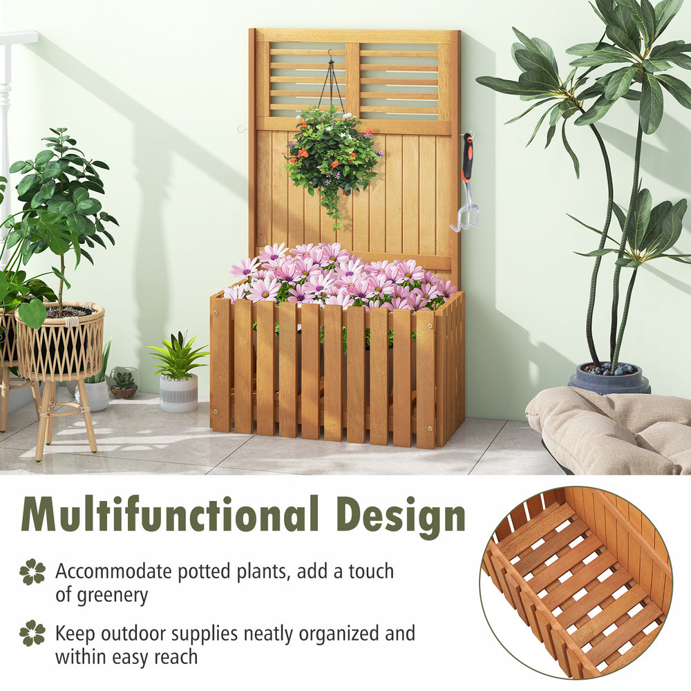 Wooden raised garden bed with privacy screen, featuring potted plants and hooks for outdoor organization and decoration.