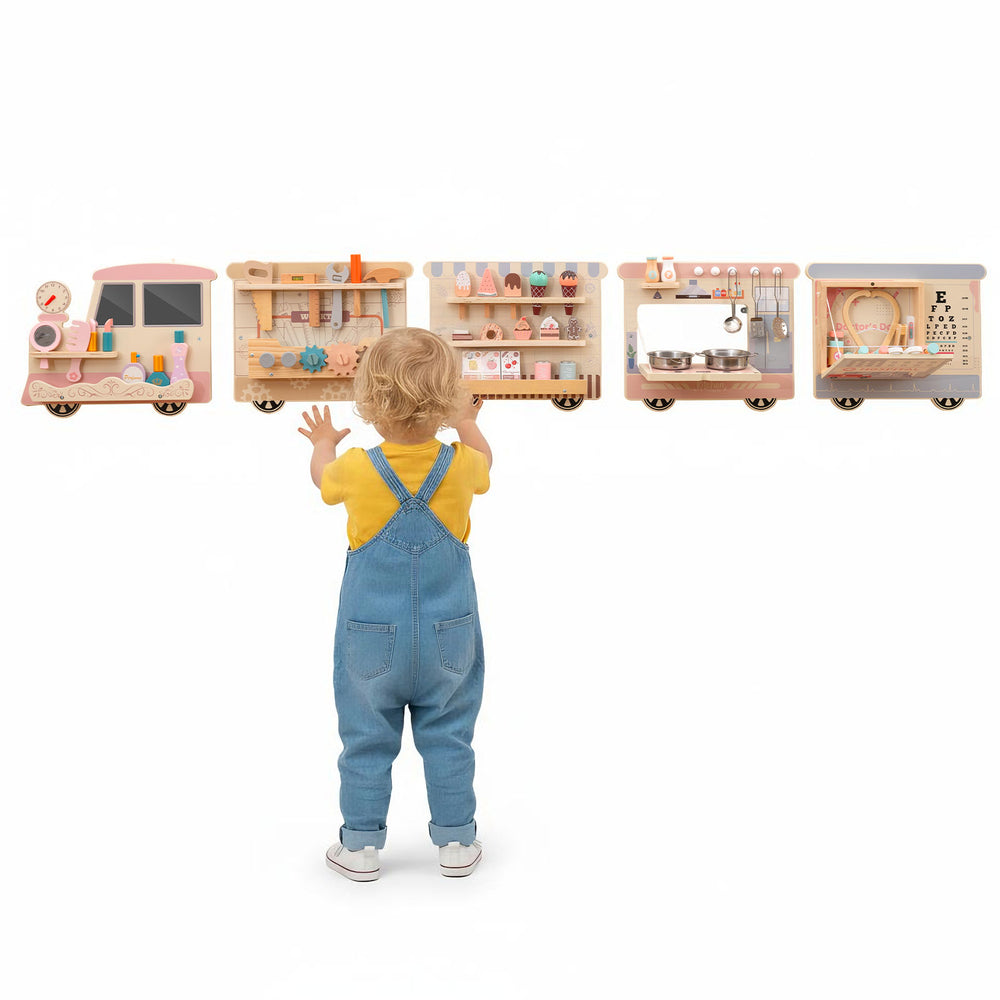 Wooden sensory wall panel train with vanity, tool box, and kitchen for imaginative role-play in playrooms or classrooms.