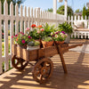 Wooden wagon planter with wheels, featuring a large slatted box for flowers and durable fir wood, ideal for indoor and outdoor use.