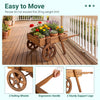 Wooden wagon planter with wheels features solid fir wood, slatted design for drainage, and ergonomic handle for easy movement.