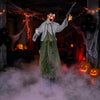 Life-size zombie Halloween decoration with glowing red eyes, bloody outfit, and simulated knife for a terrifying haunted scene.