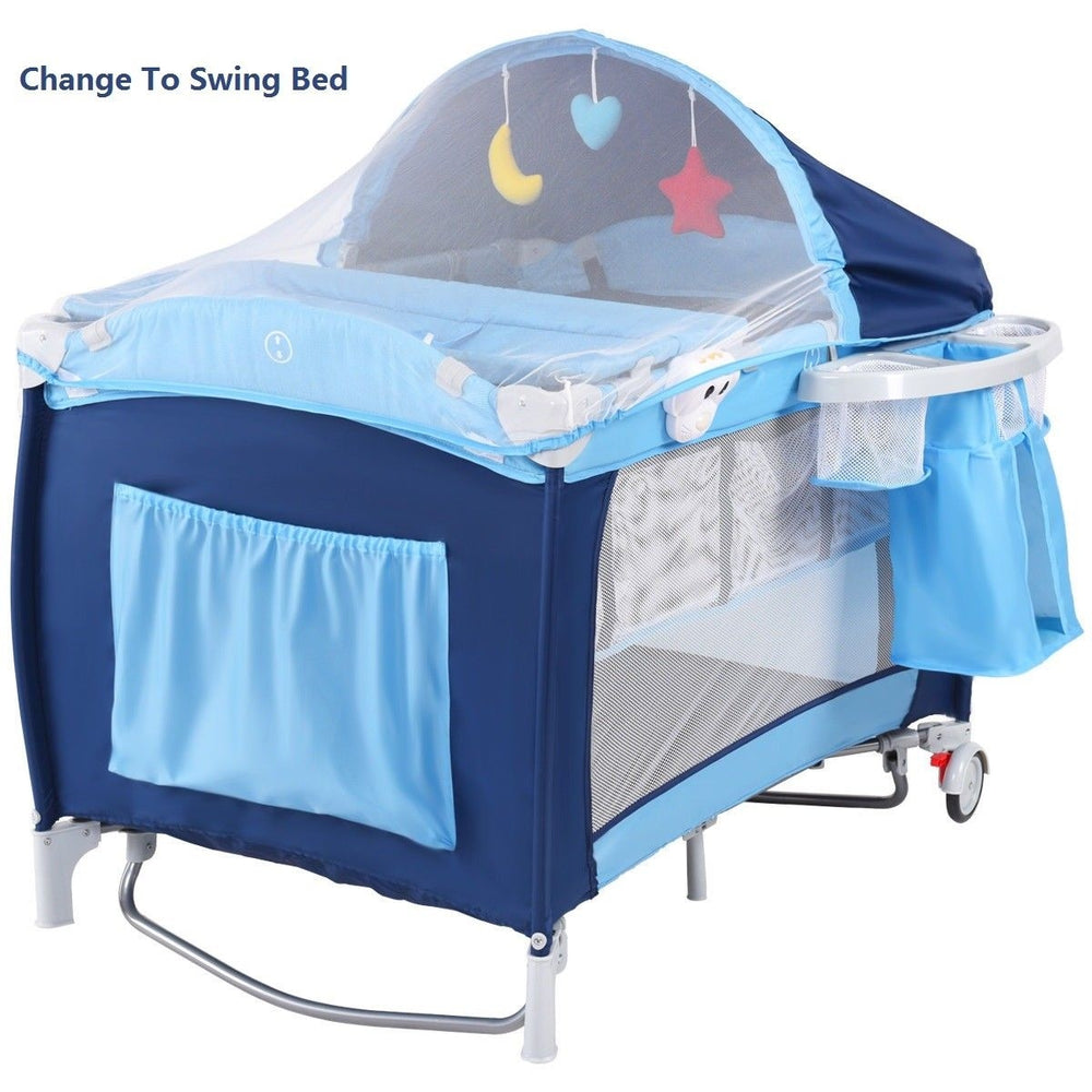 Foldable baby crib playpen in blue with mosquito net, storage bag, and detachable rocking legs for travel convenience.